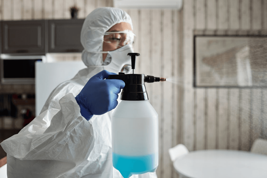 a person holding a spray